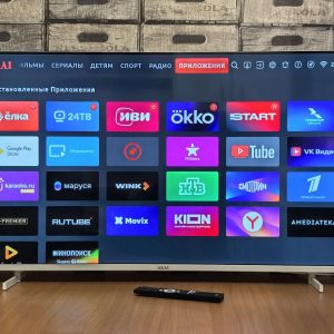 Smart TV screen displaying various application icons.